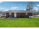 Spacious backyard with a concrete patio and freshly cut grass at 145 Pinehurst Dr, Stockbridge, GA 30281