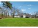 Charming single Gathering home with an inviting front yard and a private driveway at 145 Pinehurst Dr, Stockbridge, GA 30281