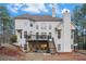 Large backyard with a deck, patio, and wooded surroundings at 3647 Little Spg, Stockbridge, GA 30281