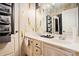 This bathroom has double sinks with custom cabinets and framed mirrors at 3647 Little Spg, Stockbridge, GA 30281