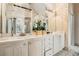 This bathroom has double sinks, custom cabinets and lighting, and framed mirrors at 3647 Little Spg, Stockbridge, GA 30281