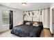 Modern bedroom features a black bed set, and unique artwork at 3647 Little Spg, Stockbridge, GA 30281