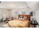 This bedroom has warm neutral wall paint, a seating area, and an ensuite bath at 3647 Little Spg, Stockbridge, GA 30281