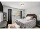Comfortable bedroom with a soft bed, dresser, and gray accents at 3647 Little Spg, Stockbridge, GA 30281