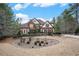 Beautiful brick home showcasing meticulous landscaping and a circular driveway at 3647 Little Spg, Stockbridge, GA 30281