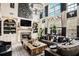 Open living room featuring a fireplace, built-in shelving, and oversized windows at 3647 Little Spg, Stockbridge, GA 30281