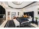 This main bedroom offers neutral wall paint, and lots of natural light with a seating area near the black accent wall at 3647 Little Spg, Stockbridge, GA 30281