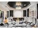 Chic sitting room with plush seating, elegant chandelier, and custom wine storage at 3647 Little Spg, Stockbridge, GA 30281
