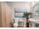 Cozy bathroom featuring modern fixtures, decorative mirror, and unique wall art at 3647 Little Spring Dr, Stockbridge, GA 30281