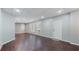 A finished basement features vinyl flooring, neutral colored walls, and natural light from three windows at 4146 Mcever Park Dr, Acworth, GA 30101