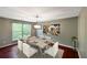 Inviting dining room with modern chandelier, elegant table setting, and bright natural light at 4146 Mcever Park Dr, Acworth, GA 30101