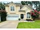 Charming two-story home with a well-maintained lawn, lovely landscaping, and an attached two-car garage at 4146 Mcever Park Dr, Acworth, GA 30101