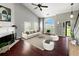 Bright living room boasts high ceilings, a cozy fireplace, and a neutral palette ideal for relaxation and entertaining at 4146 Mcever Park Dr, Acworth, GA 30101