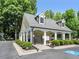 Community pool house featuring a fenced-in area with a covered patio, perfect for relaxing poolside at 4146 Mcever Park Dr, Acworth, GA 30101