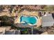 Aerial view of the backyard featuring a custom pool, patio, and lush landscaping at 4755 Columns Se Dr, Marietta, GA 30067