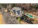Beautiful aerial shot of the home showcasing the backyard swimming pool, manicured grounds, and stunning architectural design at 4755 Columns Se Dr, Marietta, GA 30067