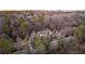 A sprawling estate with a meticulously landscaped yard surrounded by mature trees and greenery at 4755 Columns Se Dr, Marietta, GA 30067