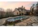 Elegant backyard showcasing a custom pool, stone accents, and an inviting patio at 4755 Columns Se Dr, Marietta, GA 30067