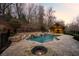Backyard pool with stone waterfall and an outdoor pool house at 4755 Columns Se Dr, Marietta, GA 30067