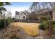 Beautiful backyard with manicured lawn, mature trees, and lush landscaping creating a private outdoor space at 4755 Columns Se Dr, Marietta, GA 30067