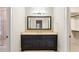 Bathroom vanity featuring a large mirror, dark wood cabinetry, and beige countertops at 4755 Columns Se Dr, Marietta, GA 30067