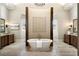 Luxurious bathroom featuring a freestanding tub and double vanities at 4755 Columns Se Dr, Marietta, GA 30067