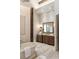 Luxurious bathroom featuring a freestanding tub, tiled floor, and a dark wood vanity at 4755 Columns Se Dr, Marietta, GA 30067