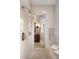 Modern shower room with multiple shower heads and a peek at the wooden vanity in the bathroom at 4755 Columns Se Dr, Marietta, GA 30067