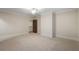 Large carpeted bedroom featuring neutral walls and access to the stairwell at 4755 Columns Se Dr, Marietta, GA 30067