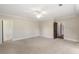 Expansive bedroom featuring neutral carpet, recessed lighting, and a ceiling fan for added comfort at 4755 Columns Se Dr, Marietta, GA 30067