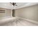 Bedroom featuring neutral walls, carpet flooring, and dark doors leading to another room at 4755 Columns Se Dr, Marietta, GA 30067