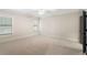 Expansive bedroom with neutral tones, carpeting, and a ceiling fan at 4755 Columns Se Dr, Marietta, GA 30067