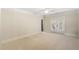 Bright bedroom featuring neutral carpet, crown molding, and access to a private balcony at 4755 Columns Se Dr, Marietta, GA 30067