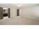 Large bedroom featuring neutral carpet and doors to the bathroom and hallway at 4755 Columns Se Dr, Marietta, GA 30067