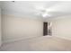 Spacious bedroom featuring neutral carpet, crown molding and view to the hall at 4755 Columns Se Dr, Marietta, GA 30067