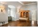 Bright bonus room with hardwood floors, custom cabinetry, and arched window at 4755 Columns Se Dr, Marietta, GA 30067