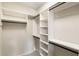 Walk-in closet with custom shelving and hanging rods for organization at 4755 Columns Se Dr, Marietta, GA 30067