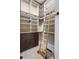 Custom closet features a rolling ladder for upper storage access at 4755 Columns Se Dr, Marietta, GA 30067