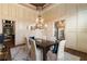 Beautiful dining room with elegant wall decor and a statement chandelier at 4755 Columns Se Dr, Marietta, GA 30067