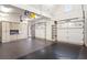 A well-lit garage with custom cabinets, a utility sink, and storage shelves, offering organization and functionality at 4755 Columns Se Dr, Marietta, GA 30067