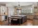 Well-appointed kitchen with custom cabinets, granite countertops, and a wine refrigerator at 4755 Columns Se Dr, Marietta, GA 30067
