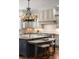 Modern kitchen showcasing a large island, custom cabinets, and granite countertops at 4755 Columns Se Dr, Marietta, GA 30067