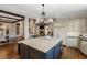 Gourmet kitchen featuring a large island, breakfast bar, and stainless steel appliances at 4755 Columns Se Dr, Marietta, GA 30067