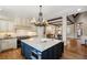 Open concept kitchen with a large island, custom cabinets, and modern appliances at 4755 Columns Se Dr, Marietta, GA 30067
