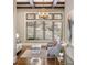 Bright living room features hardwood floors, large windows, and a stylish chandelier at 4755 Columns Se Dr, Marietta, GA 30067