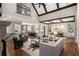 Open concept living room with high ceilings, exposed beams, and seamless flow to the kitchen at 4755 Columns Se Dr, Marietta, GA 30067