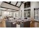 Bright living room featuring vaulted ceilings, exposed wood beams, and large windows at 4755 Columns Se Dr, Marietta, GA 30067