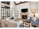 Comfortable living room boasts fireplace, built-in shelves and large windows at 4755 Columns Se Dr, Marietta, GA 30067