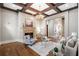 Cozy living room features a coffered ceiling, stone fireplace, and ample seating at 4755 Columns Se Dr, Marietta, GA 30067