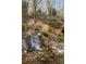 Picturesque backyard waterfall feature with natural stone accents and lush landscaping at 4755 Columns Se Dr, Marietta, GA 30067